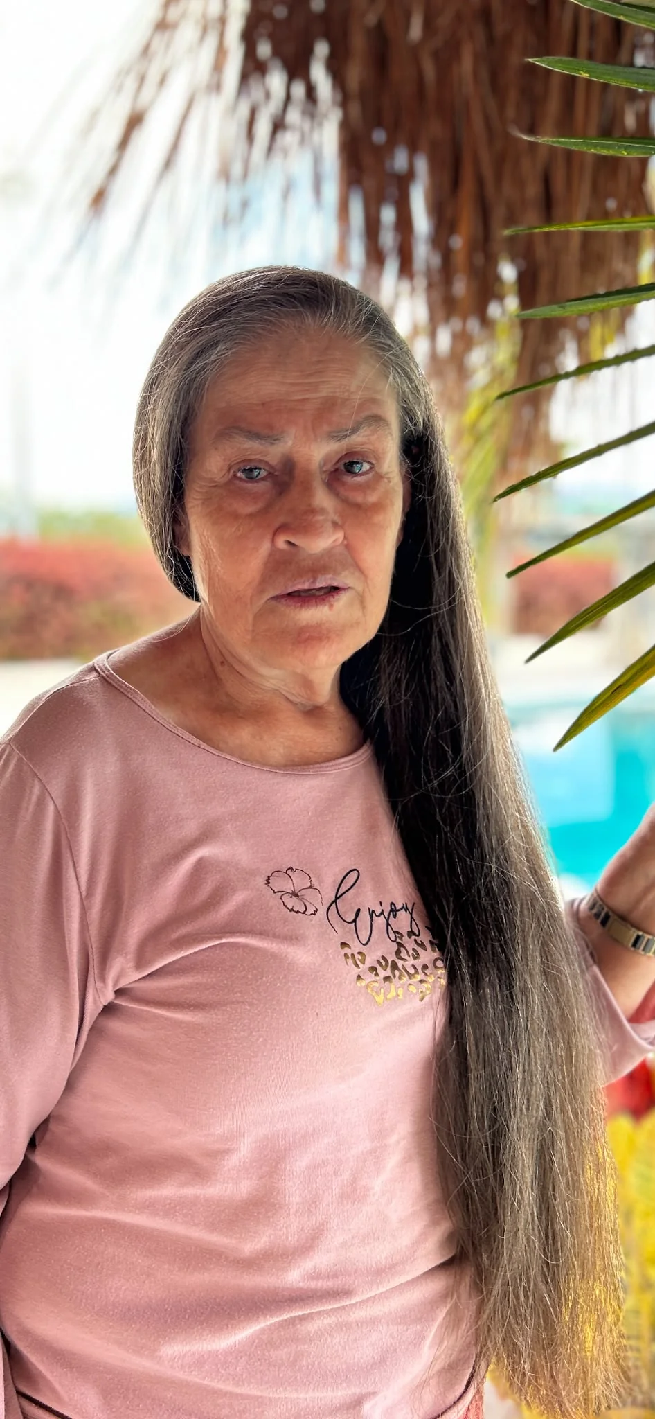 Portrait of an older woman with long hair, in Miriam Orozco’s family